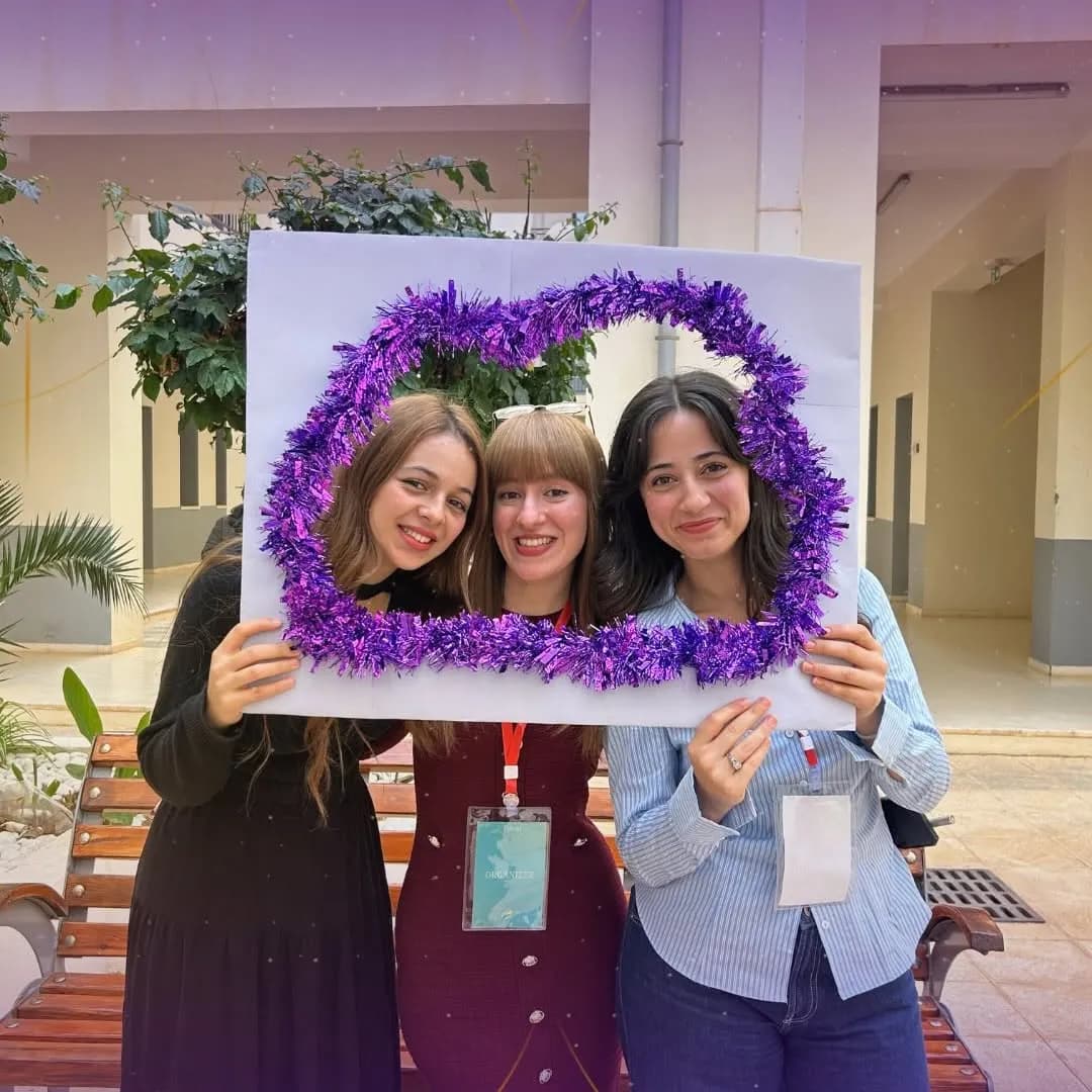 Three EUNOIA participants posing in a photo frame