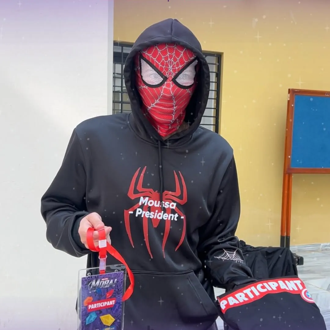 A MobAI participant in a Spider-Man mask with his participant badge