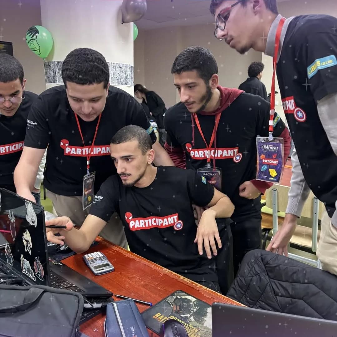 A MobAI team working on their laptop